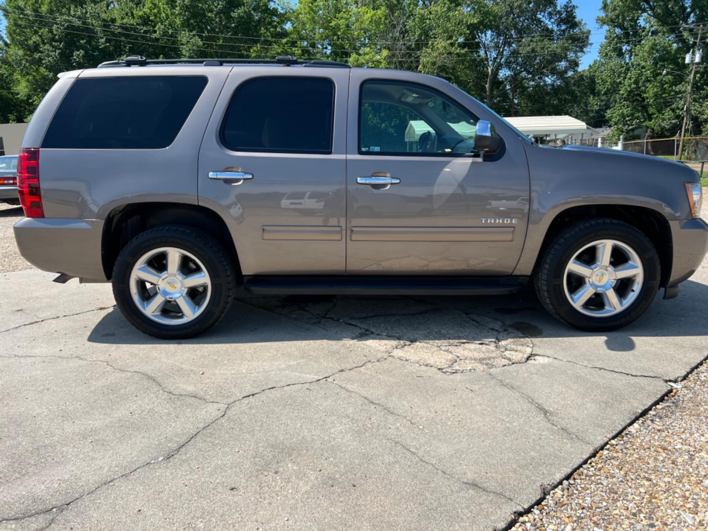 2014 Brown /Tan Chevrolet Tahoe LS (1GNSCAE04ER) with an 5.3L V8 engine, Automatic transmission, located at 4520 Airline Hwy, Baton Rouge, LA, 70805, (225) 357-1497, 30.509325, -91.145432 - 2014 Chevy Tahoe LS 5.3 V8 Gas, 147K Miles, 8 Passenger Seating, Backup Camera, Power Windows, Locks & Mirrors, Cold A/C, Tow Pkg. FOR INFO PLEASE CONTACT JEFF AT 225 357-1497 CHECK OUT OUR A+ RATING WITH THE BETTER BUSINESS BUREAU WE HAVE BEEN A FAMILY OWNED AND OPERATED BUSINESS AT THE SAME LOCA - Photo#4